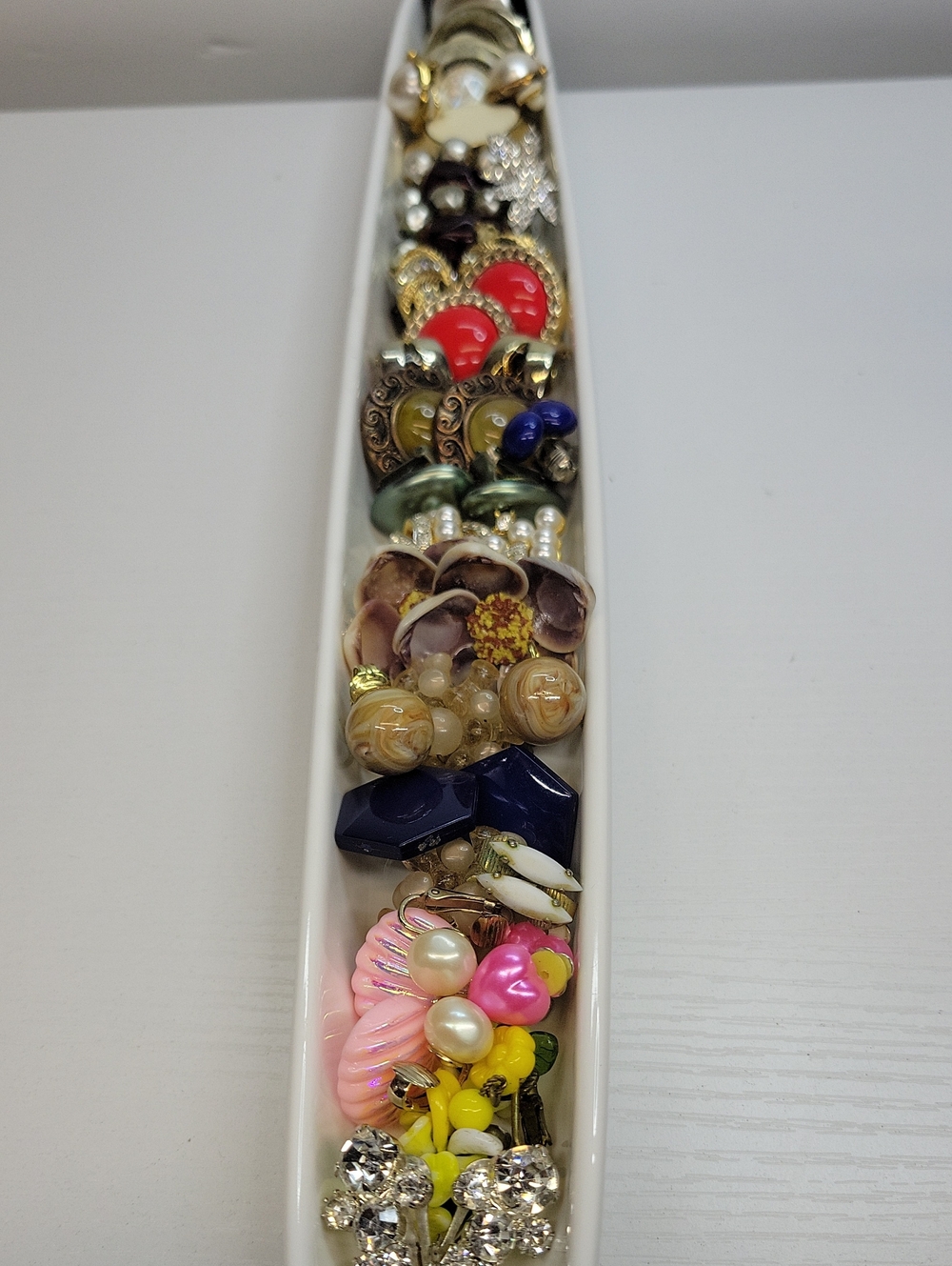 Long Dish Filled With Clip On Earrings